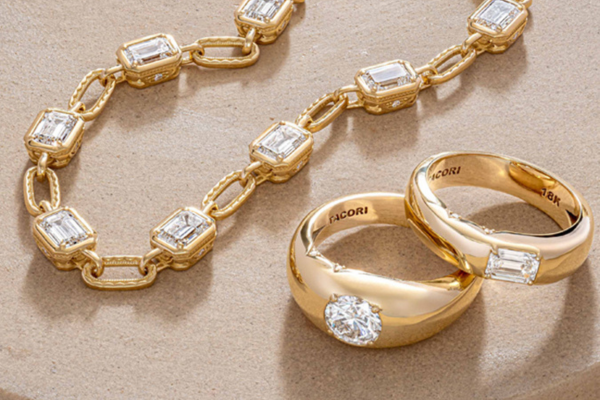 Bezel set fine jewelry in 18 karat gold with a quiet luxury aesthetic